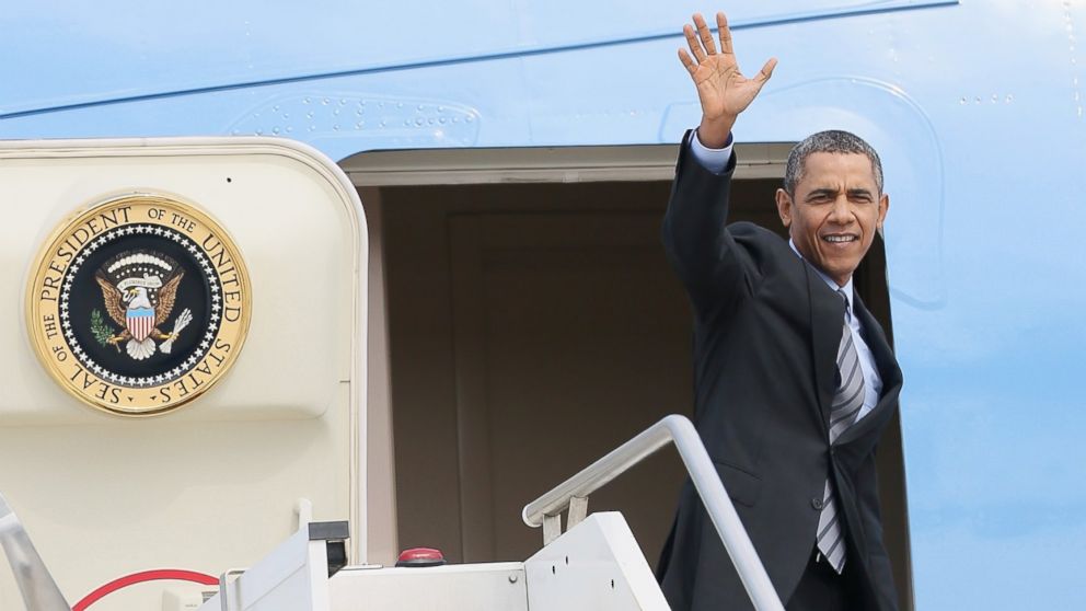 PHOTO: Barack Obama waves as he walks down the stairs from Air Force One at Fiumicino Airport on March 28, 2014 in Rome, Italy. 