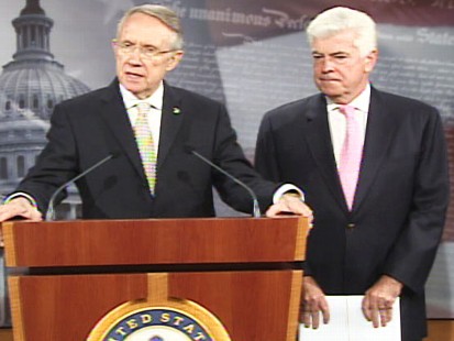 pic of senator reid and senator dodd discussing the bailout bill