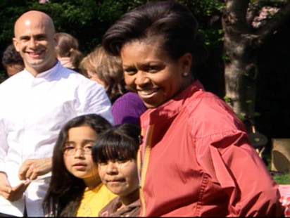 Video of First Lady Michelle Obama telling the press the first dog is coming "soon."