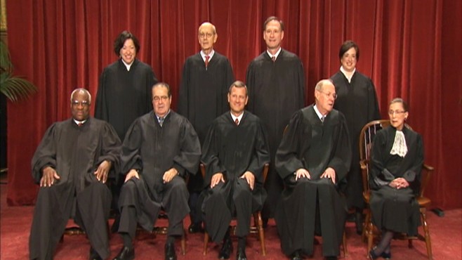 Video of Supreme Court justices posing for photo.