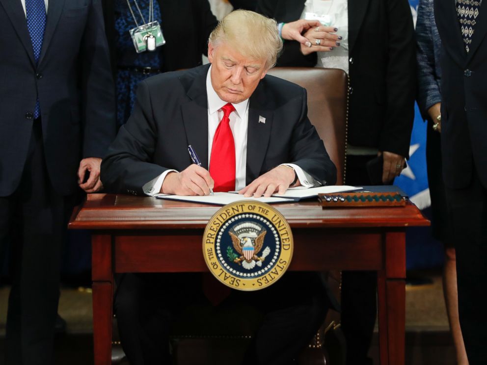 PHOTO: President Donald Trump signs an executive order for border security and immigration enforcement improvements at the Department of Homeland Security in Washington, Jan. 25, 2017.