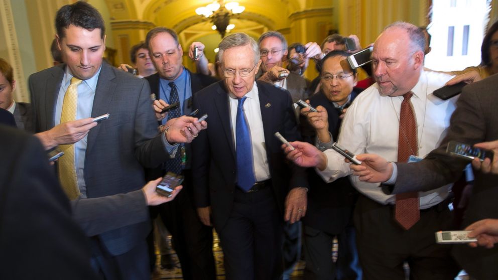 PHOTO: Senate Majority Leader Sen. Harry Reid, D-Nev., is surrounded by reporters