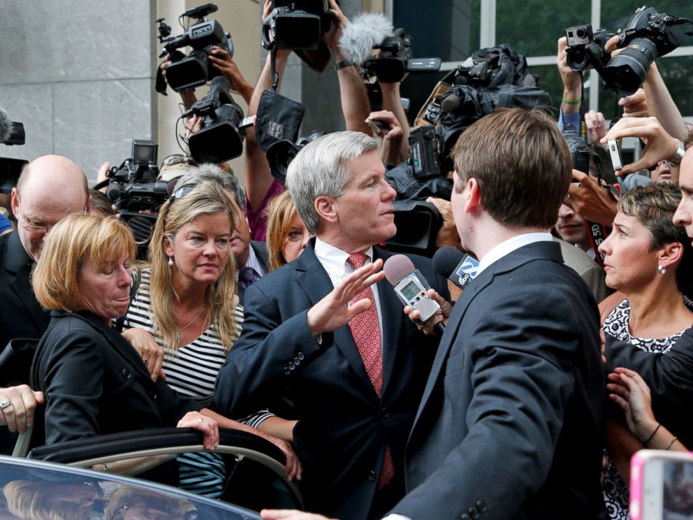 PHOTO: Former Virginia Gov. Bob McDonnell, center, is mobbed by media as he gets into a car with his son after he and his wife were convicted on multiple counts of corruption at Federal Court in Richmond, Va., Sept. 4, 2014.
