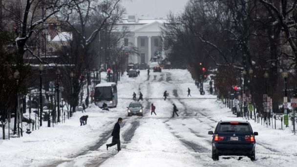 People cross 16th Street NW in front of the White House, Feb. 13, 2014, in Washington. AP dc snow tk 140213 16x9 608 Freeze! Snow Stalls DC