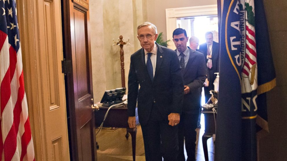 PHOTO: Senate Majority Leader Harry Reid, D-Nev., leaves the Capitol office of his Republican counterpart