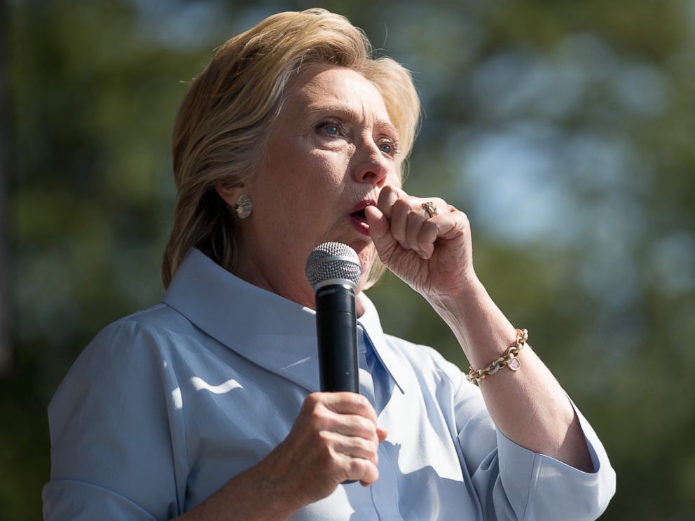 PHOTO: Democratic presidential candidate Hillary Clinton stops her speech to cough at the 11th Congressional District Labor Day festival at Luke Easter Park in Cleveland, Sept. 5, 2016.