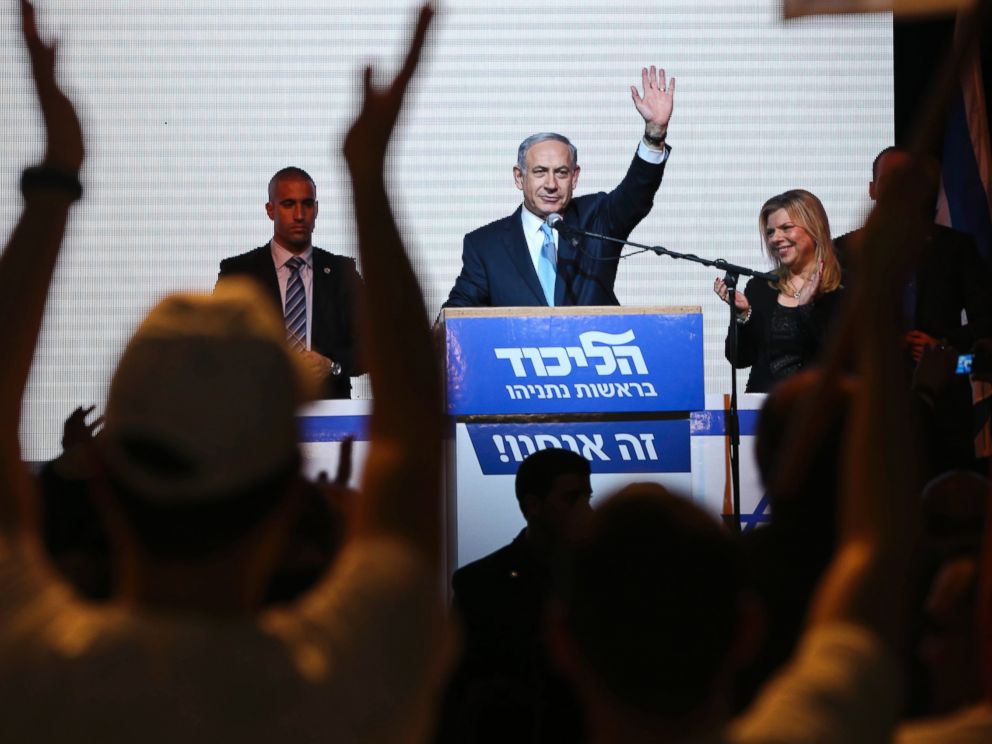 PHOTO: Israeli Prime Minister Benjamin Netanyahu greets supporters at the partys election headquarters