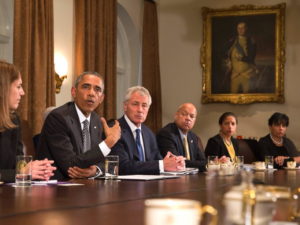 PHOTO: President Barack Obama, second from left, speaks to the media about Ebola during a meeting in the Cabinet Room of the White House in Washington, Oct. 15, 2014.