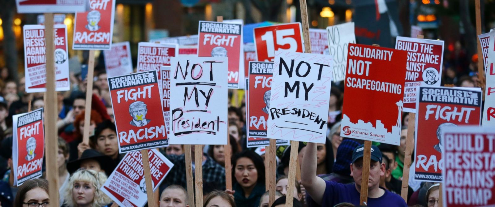 PHOTO: Protesters hold signs during a protest against the election of President-elect Donald Trump, Wednesday, Nov. 9, 2016, in downtown Seattle. (AP Photo/Ted S. Warren)