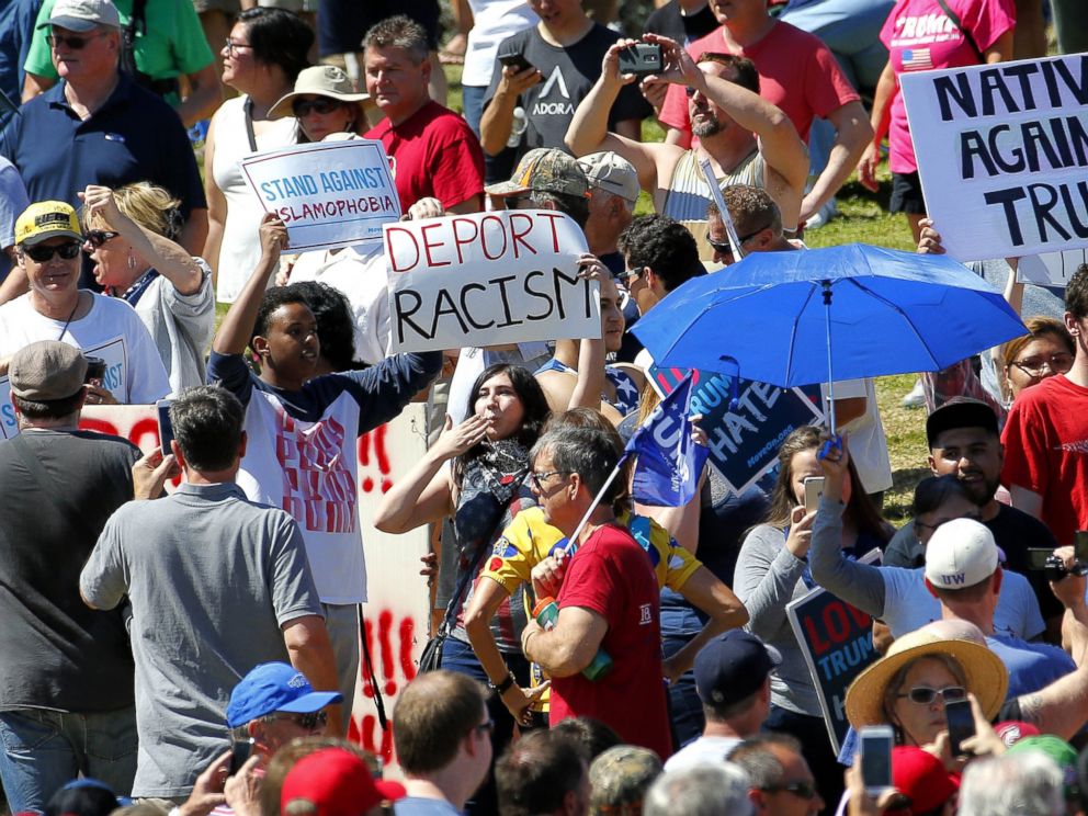 PHOTO:Protesters stand in the crowd of Republican presidential candidate Donald Trump supporters as Trump speaks during a campaign rally, March 19, 2016, in Fountain Hills, Ariz.