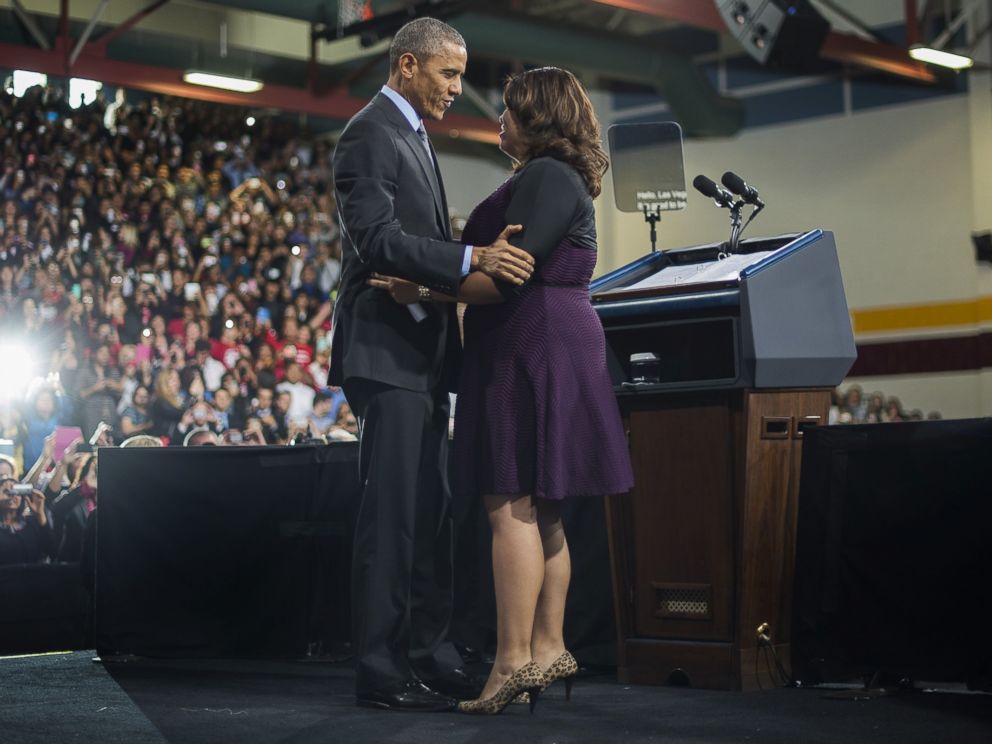 PHOTO: President Barack Obama hugs Astrid Silva, an activist, as he arrives to deliver remarks on the new steps he will be taking within his executive authority on immigration at Del Sol High School in Las Vegas, Nov. 21, 2014.