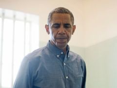 PHOTO: President Barack Obama visits the cell where Nelson Mandela, an anti-apartheid activist, was once jailed on Robben Island, June 30, 2013.