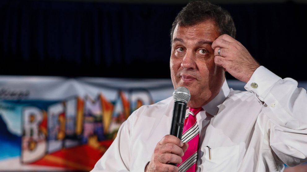 PHOTO: Chris Christie speaks with families affected by Superstorm Sandy on March 25, 2014 in Belmar, N.J.