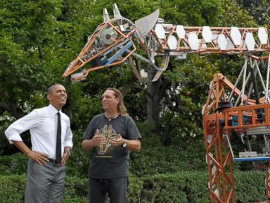 President Obama Tickles a Giant Robotic Giraffe