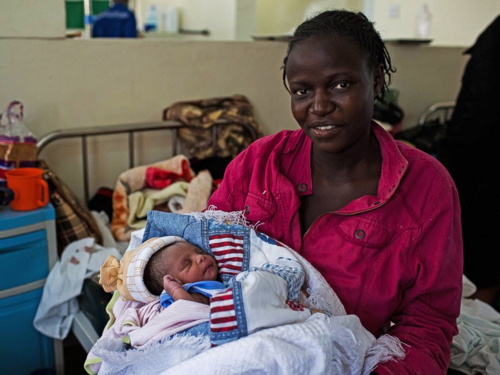 PHOTO: Millicent Akinyo holds her new born baby girl, named Michelle in honor of US First Lady Michelle Obama, at the Mbagathi Hospital in Nairobi on July 26, 2015.