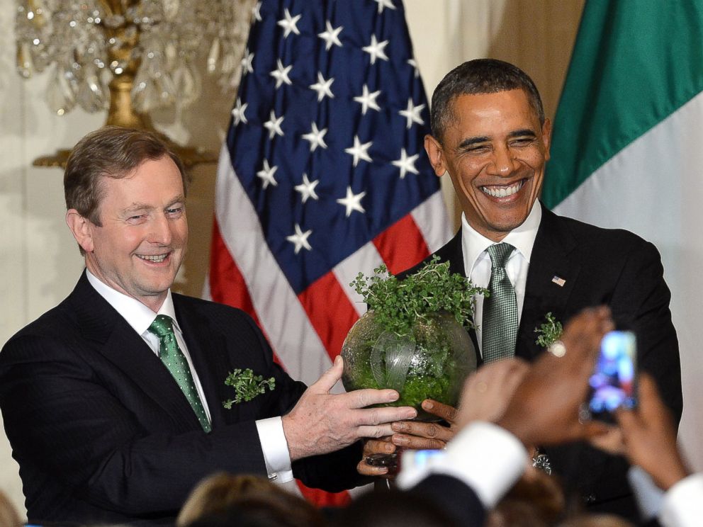 PHOTO: Irish Prime Minister Enda Kenny presents a bowl of shamrock to President Barack during a St. Patricks Day reception in the East Room at the White House in Washington, March 19, 2013.