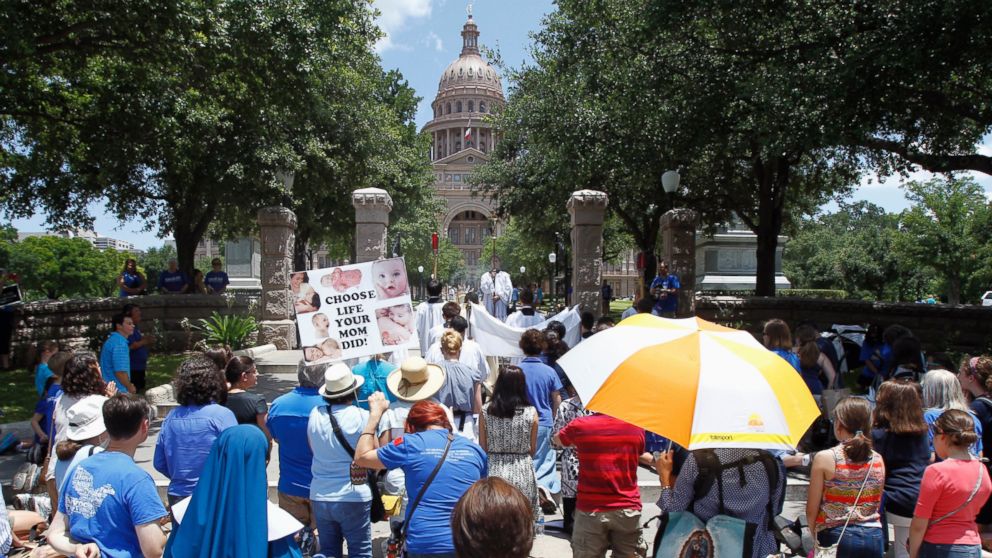 PHOTO: Catholic anti-abortion activist participate in a rosary procession as the state legislature meets to consider legislation restricting abortion rights in Austin, Texas in this July 9, 2013, file photo. 