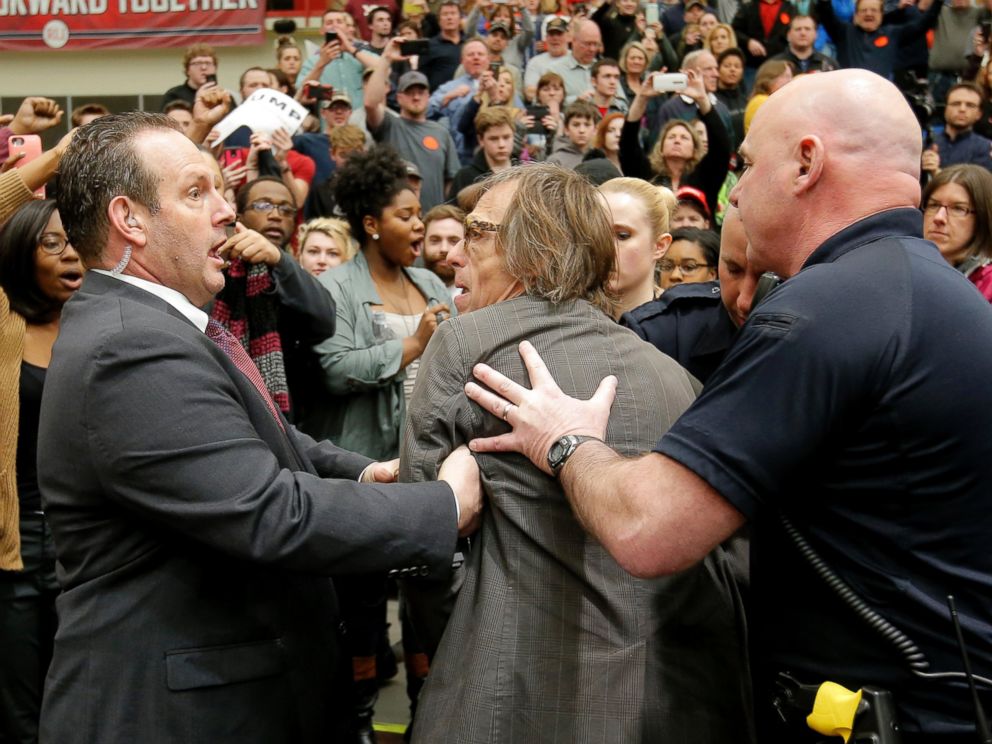 PHOTO: Photographer Christopher Morris is removed by security officials as Donald Trump speaks during a campaign event in Radford, Virginia, Feb. 29, 2016.