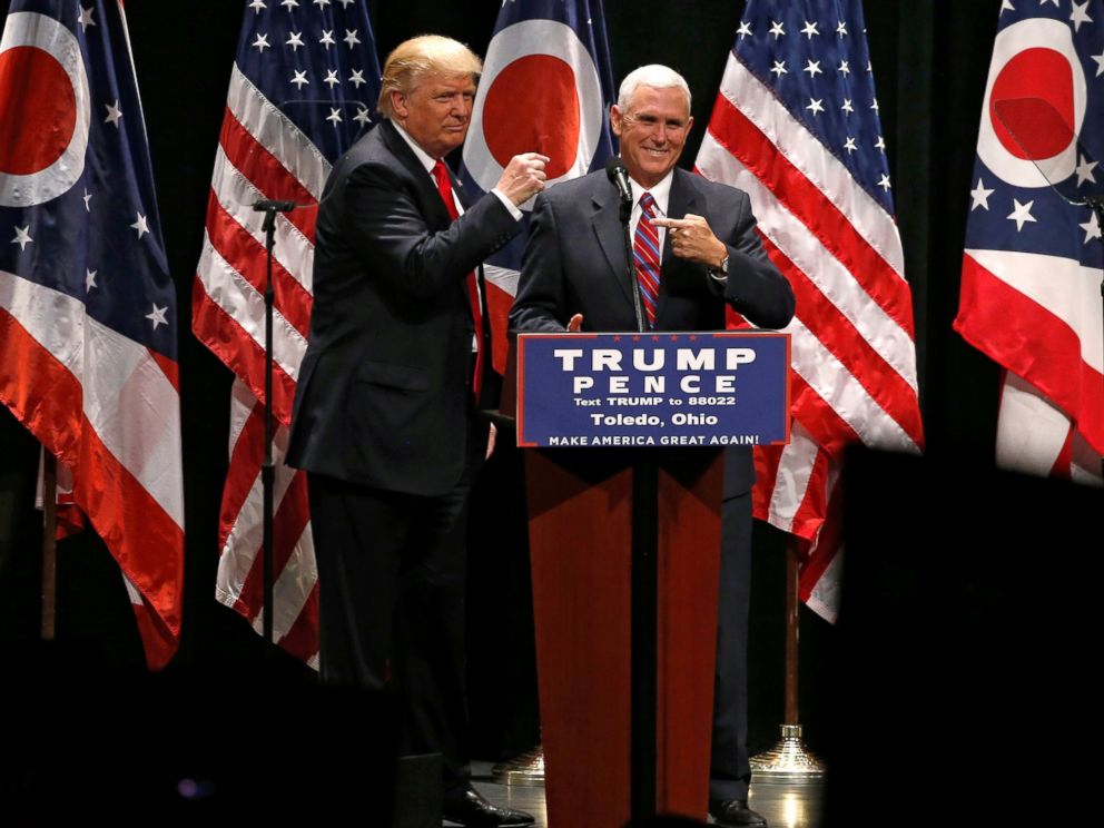 PHOTO: Republican presidential nominee Donald Trump brings vice presidential nominee Mike Pence onstage as he rallies with supporters in Toledo, Ohio, Sept. 21, 2016.