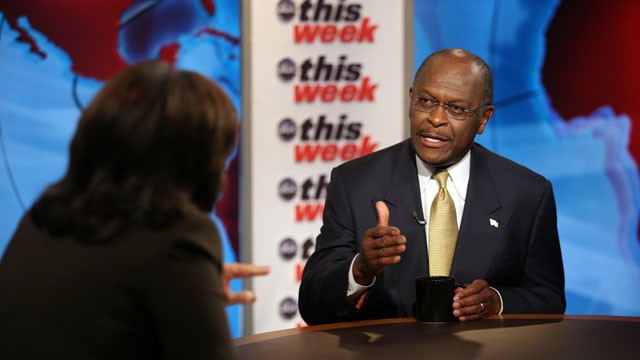 PHOTO: GOP candidate Cain discusses keeping up his campaigns momentum