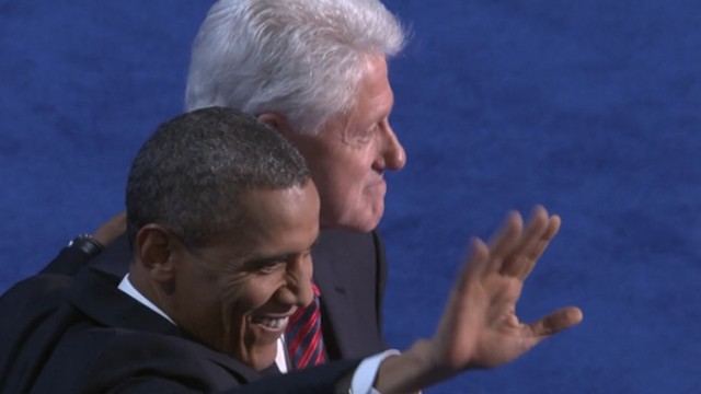 Former and current presidents embrace on stage in front of thousands of DNC delegates.