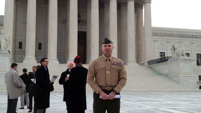 PHOTO: Major David McCombs , U.S. Marine Corps, standing in line to hear arguments before the U.S. Supreme Court on whether the government can make it a crime to lie about war medals.