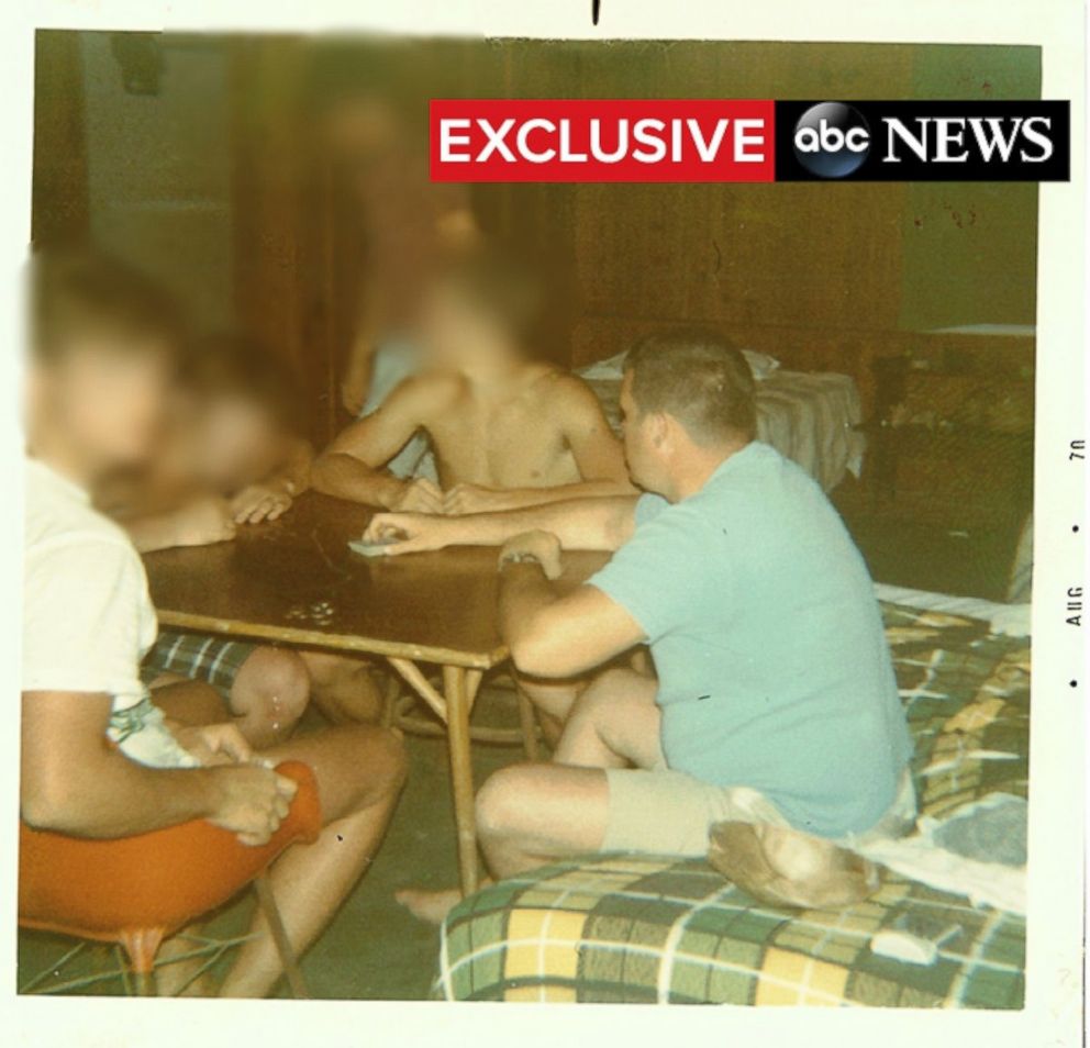 PHOTO: Dennis Hastert, right, plays cards with members of the Explorers Club in the Bahamas.