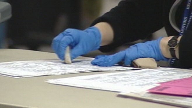 VIDEO: County workers in California are using rubber erasers to scrub smudges on mail-in ballots.