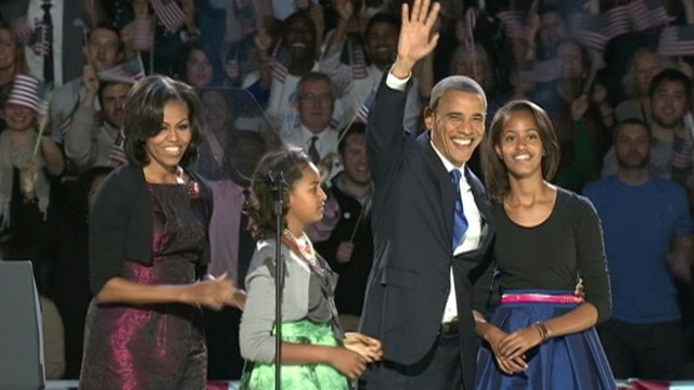 VIDEO: Michelle Obama wore a silk Michael Kors dress and Sasha and Malia wore bright, knee-length skirts.
