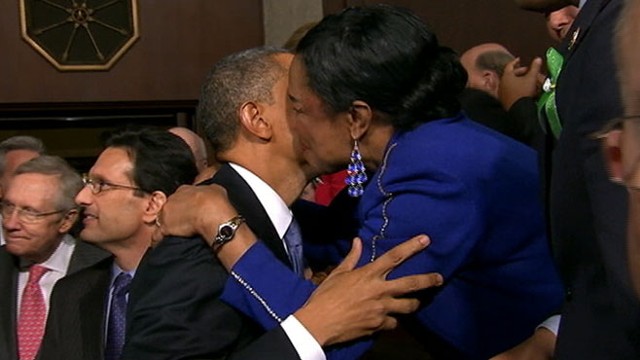 VIDEO: Rep. Frederica Wilson leaves red lipstick stain on the presidents face.
