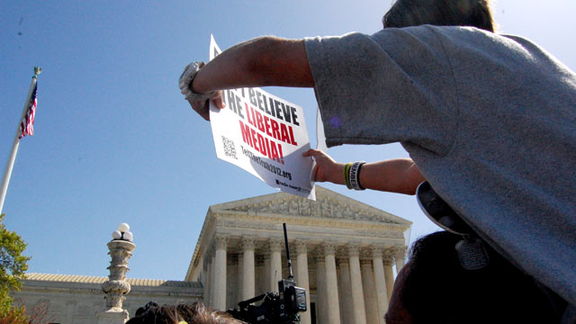 PHOTO: Tea Party activists protest outside the Supreme Court, March 26, 2012 in Washington, D.C.