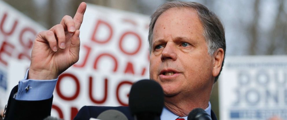 PHOTO: Democratic candidate for U.S. Senate Doug Jones speaks to reporters after casting his ballot on Dec. 12, 2017, in Mountain Brook, Ala.