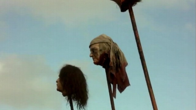 VIDEO: Severed replica of Bushs head mounted on a stake appears in some scenes.
