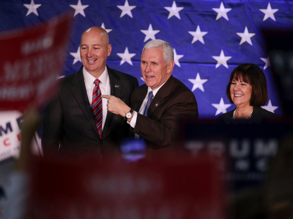 PHOTO: Mike Pence, and his wife Karen, stand on stage with Nebraska Governor Pete Ricketts before speaking at a campaign stop in Omaha, Oct. 27, 2016. 