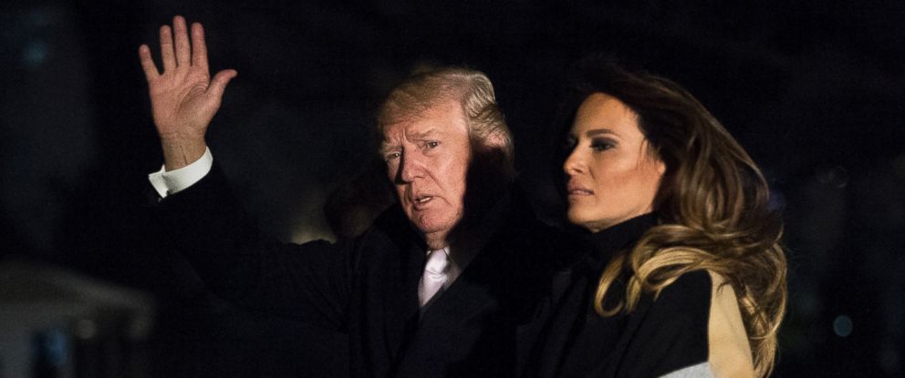 President Donald Trump with first lady Melania Trump waves as he returns to the White House in Washington, Monday, Jan. 15, 2018. Trump spent the holiday weekend at his Mar-a-Lago estate in Palm Beach, Fla.