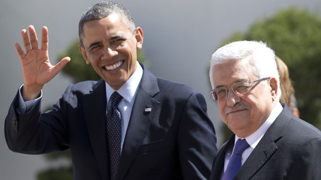 PHOTO: President Barack Obama waves to media as he walks with Palestinian President Mahmoud Abbas, right, as he arrives at the Muqata Presidential Compound Thursday, March 21, 2013, in the West Bank town of Ramallah.