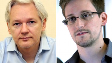 Julian Assange speaks to the media inside the Ecuadorian Embassy in London ahead of the first anniversary of his arrival there on June 19, 2012. This June 9, 2013 photo provided by The Guardian newspaper in London shows Edward Snowden, who worked as a contract employee at the U.S. National Security Agency, in Hong Kong.