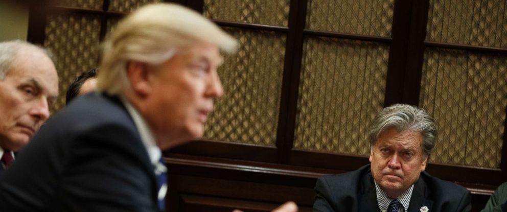 PHOTO: White House Chief Strategist Steve Bannon listens at right as President Donald Trump speaks during a meeting on cyber security in the Roosevelt Room of the White House in Washington, Jan. 31, 2017. 