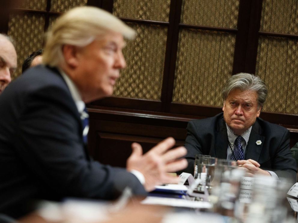 PHOTO: White House Chief Strategist Steve Bannon listens at right as President Donald Trump speaks during a meeting on cyber security in the Roosevelt Room of the White House in Washington, Tuesday, Jan. 31, 2017.