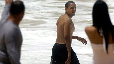 PHOTO: President Barack Obama, then senator, is shown walking on the beach after body-surfing in Honolulu, Hawaii.