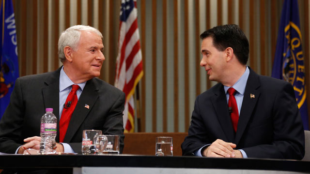 PHOTO: Republican Wisconsin Gov. Scott Walker, right, and Democratic challenger Tom Barrett look at one another as they get ready to participate in a televised debate, May 31, 2012, in Milwaukee.
