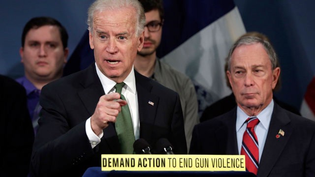 PHOTO: Vice President Joe Biden, left, accompanied by New York Mayor Michael Bloomberg, speaks in favor of an assault weapons ban in New Yorks City Hall Blue Room on March 21, 2013 as relatives of shooting victims from Newtown, Conn., stood behind them.