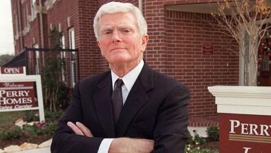 PHOTO: In this file photo, Houston homebuilder Bob Perry poses for photographers at the sales center of one of his Houston developments.