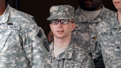 PHOTO: Army Pfc. Bradley Manning, center, is escorted out of a courthouse in Fort Meade, MD., Dec. 21, 2011, after a military hearing that will determine if he should face court-martial for his alleged role in the WikiLeaks classified leaks case.