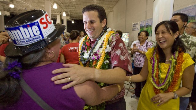 PHOTO: A supporter congratulates then-Lt. governor-elect Brian Schatz, center, as his wife Linda looks on at the Neil Abercrombie-Brian Schatz Hawaii governors post election party in Honolulu, Nov. 3, 2010. Schatz was appointed by Gov. Neil Abercrombie,