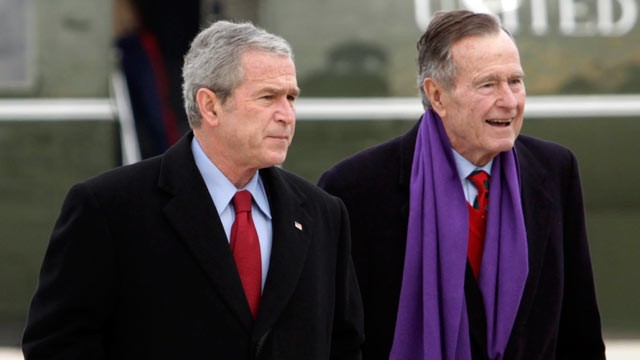 PHOTO: Former President George W. Bush walks with his father, former President George H.W. Bush, at Andrews Air Force Base, Md.