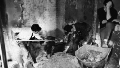 PHOTO: Law enforcement men sift through debris in a rest room on the Senate side of the Capitol, Washington on March 1, 1971 after a bomb exploded in the area.