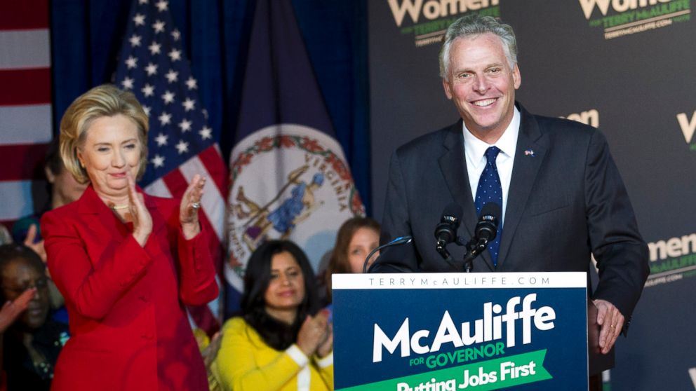 PHOTO: Former Secretary of State Hillary Clinton applauds Virginia gubernatorial candidate, Democrat Terry McAuliffe, during a campaign rally, Women for Terry, at the State Theater in Falls Church, Va. on Oct. 19, 2013.