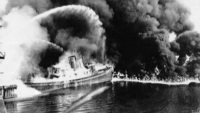PHOTO: A fire tug fights flames on the Cuyahoga River near downtown Cleveland, Ohio, where oil and other industrial wastes caught fire June 25, 1952.