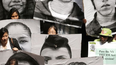 PHOTO: Supporters of the New York DREAM Act hold photos of undocumented students who are not eligible for college tuition assistance during a rally at the Capitol on Tuesday, May 21, 2013, in Albany, N.Y. The state Assembly today is expected to pass DREAM